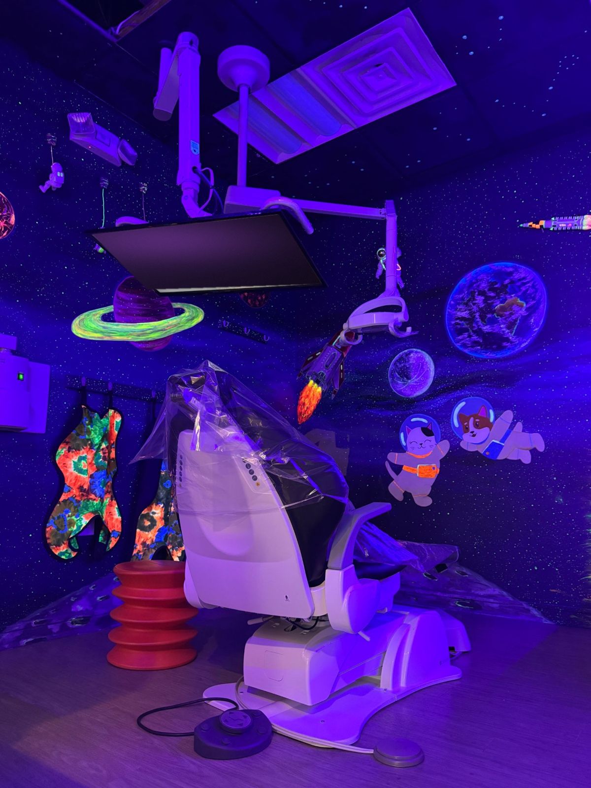 The Glow Room: a treatment room painted like outer space that glows under black light